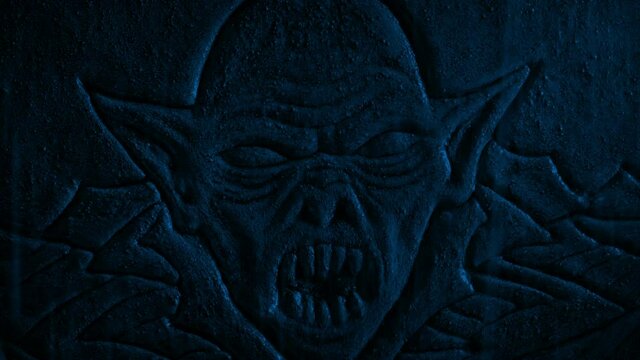 Demon Stone Carving In Heavy Rain