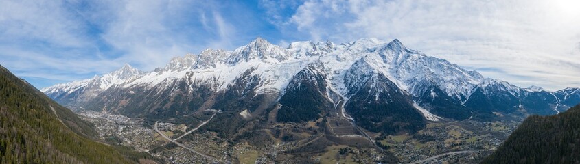 The panoramic view of the snow-capped Mont Blanc massif in Europe, France, the Alps, towards Chamonix, in spring, on a sunny day.