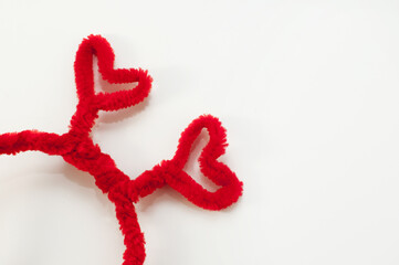 homemade headband with red hearts on a white background with a place for text