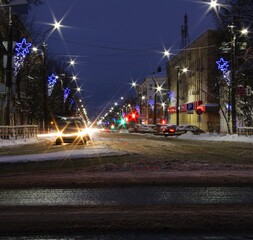 traffic on city road at night and colorful lanterns