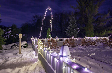 Winter park fence with Christmas lights