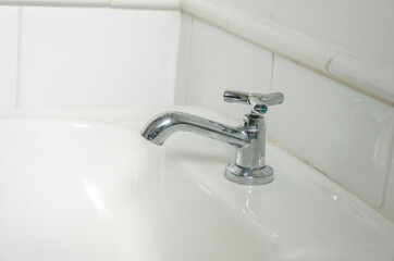 toilet white sink and faucet