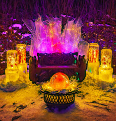 Holiday ice sculptures with wood bench display