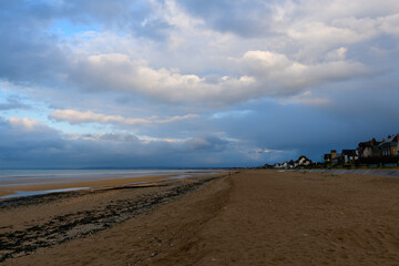 The landing beach of Sword beach in Hermanville-sur-Mer in Europe, France, Normandy, towards Ouistreham, in summer, on a sunny day.