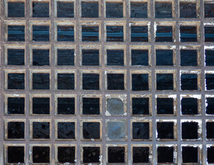 Checkered lattice. The texture of the old building. Lattice of a   abandoned building