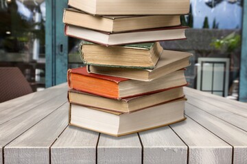 Hardcover law books stacked on wooden table on blur room background, Law Office, pile of books