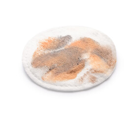 Dirty cotton pad after removing makeup on white background