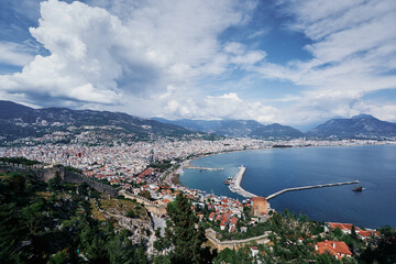 Beautiful view of Alanya city with mountains and sea bay.