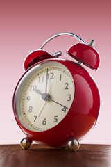 Close-up of big red alarm clock.