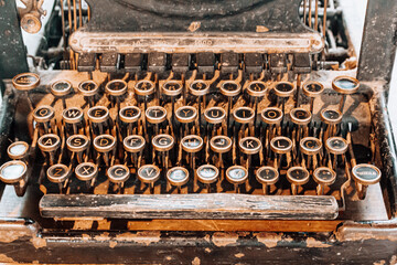 Vintage retro typewriter on wooden table. Old Technology concept.