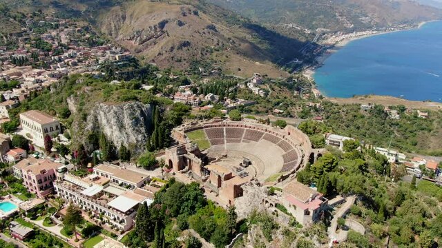 Taormina, greek theater. Drone flight slowly turning around the Ancient Greek theater of Taormina.