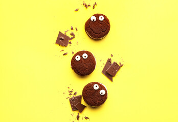 Funny chocolate cookies on color background © Pixel-Shot