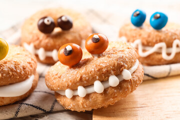 Funny cookies for Halloween on table, closeup