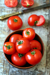 Fresh juicy red tomatoes in a bowl.