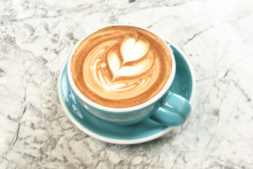 A cup of latte on the marble table               