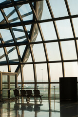 Airport window with chairs 