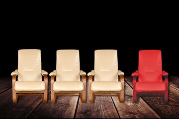 Three vacant white chairs and one red in office or room. Job recruiting, leadership and business...