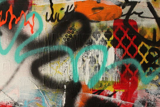 Abstract graffiti style acrylic painting featuring spray paint accents for backgrounds.