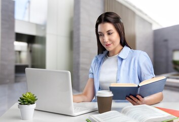 E-Learning. Cheerful Student Girl Taking Notes At Laptop Learning Distantly
