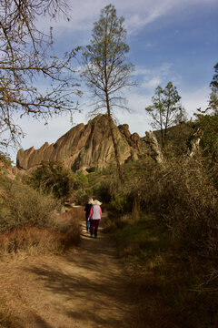 2 senior women walk together at pinnacles national, monterey county, california, u.s.a. 