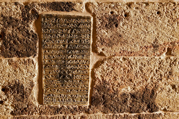 A stone tablet carved in Aramaic script lists the names of the patriarchs entombed at Deyrulzafaran Monastery in Mardin, Eastern Anatolia, Turkey