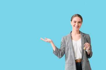 Real estate agent with key from house on blue background