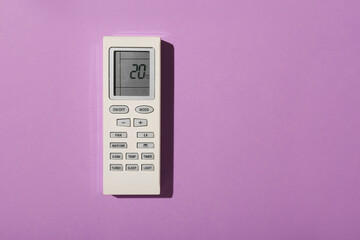 Air conditioning remote controller on color background