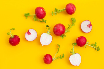 Fresh radish on yellow background.