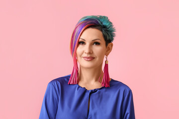 Beautiful woman with unusual hair on color background