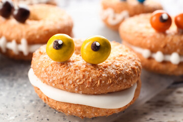 Funny cookie for Halloween on table, closeup