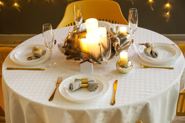 Dining table with setting for Christmas celebration indoors