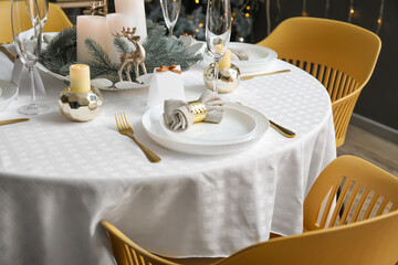 Dining table with setting for Christmas celebration indoors