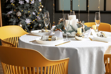 Dining table with setting for Christmas celebration indoors