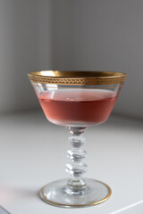 pink drink chilled rose wine in vintage crystal cocktail coupe