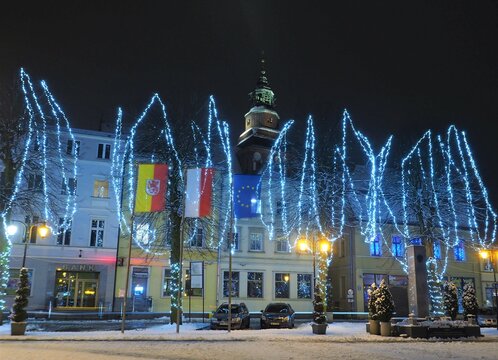 Gryfice city center  (Poland) illuminated for the festive season with its Roman Cathoric Church (Roman Catholic Parish PM. Assumption)

