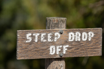 Wooden sign located on Pender Island, Canada. It says 