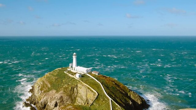 Wide view of the South Stack Lighthouse on a small island off the north-west coast of Holy Island, Anglesey, Wales, UK