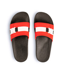 Pair of red and black rubber sandals isolated on white background.