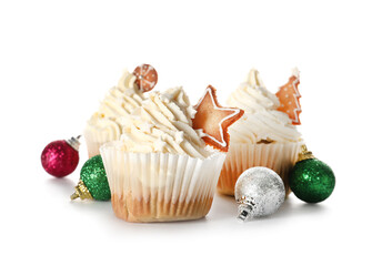 Delicious Christmas cupcakes and balls on white background