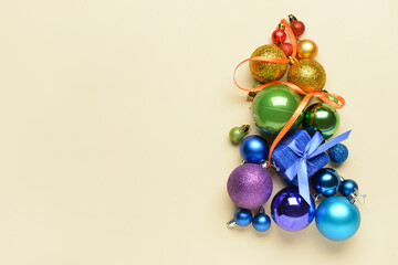 Christmas tree made of baubles on color background. LGBT concept