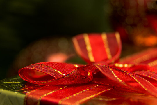 Present gift box with red ribbon