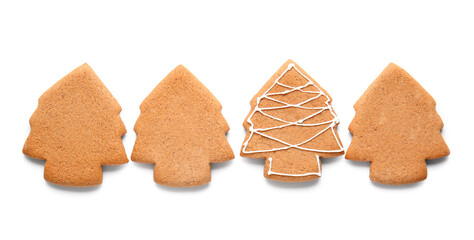 Tasty gingerbread cookies in shape of Christmas trees on white background