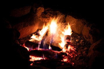 Logs finally catching in the campfire