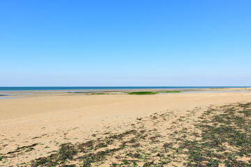 Fototapeta premium The panoramic view of Juno beach at Bernieres sur Mer in Europe, France, Normandy, Arromanches les Bains, in summer, on a sunny day.