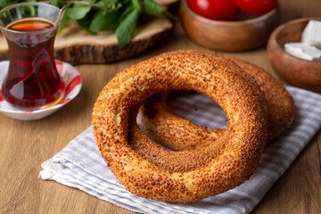 Turkish fast food bagel called Simit. Turkish bagel Simit with sesame. Bagel is traditional Turkish bakery food. Turkish name; simit - gevrek