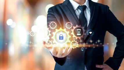 businessman holding financial security protection icon The concept of protection from Internet threats.