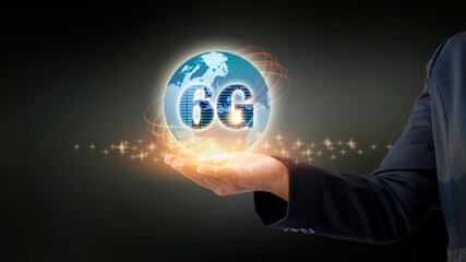 Close-up shot of mobile holding 6G hologram. Futuristic technology concept and internet speed.