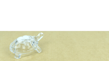 figurine of a turtle on a colored background in the studio