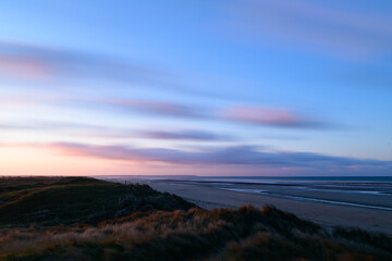 Clouds moving over Utah Beach at sunset in Europe, France, Normandy, towards Carentan, spring, on a sunny day.
