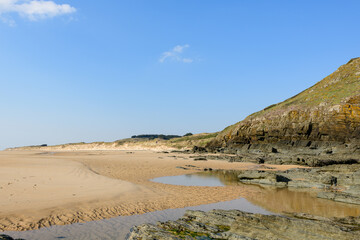 The beach of the Old Church at the foot of the cliffs in Europe, France, Normandy, Manche, in spring, on a sunny day.